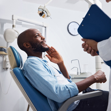 Man smiling at the dentist