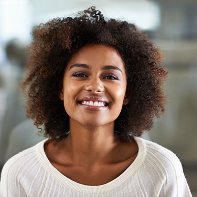 Patient in Fort Worth smiling confidently after porcelain veneer treatment 