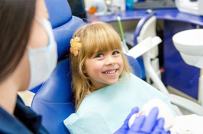 Young patient in Keller smiling at dentist.