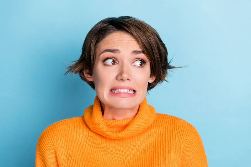 Patient cringing due to tooth pain