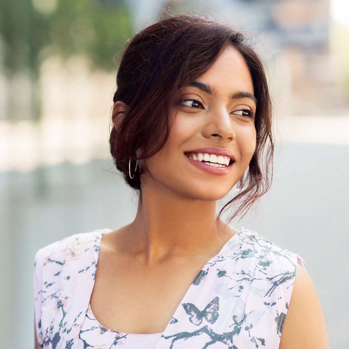 Portrait of happy smiling Indian woman outdoors